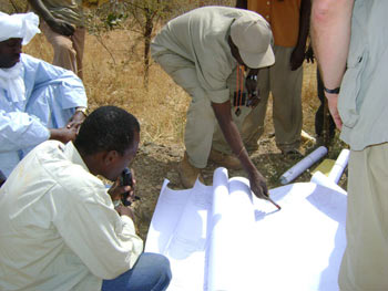 Al-Bedey staff looking at plans in Chad
